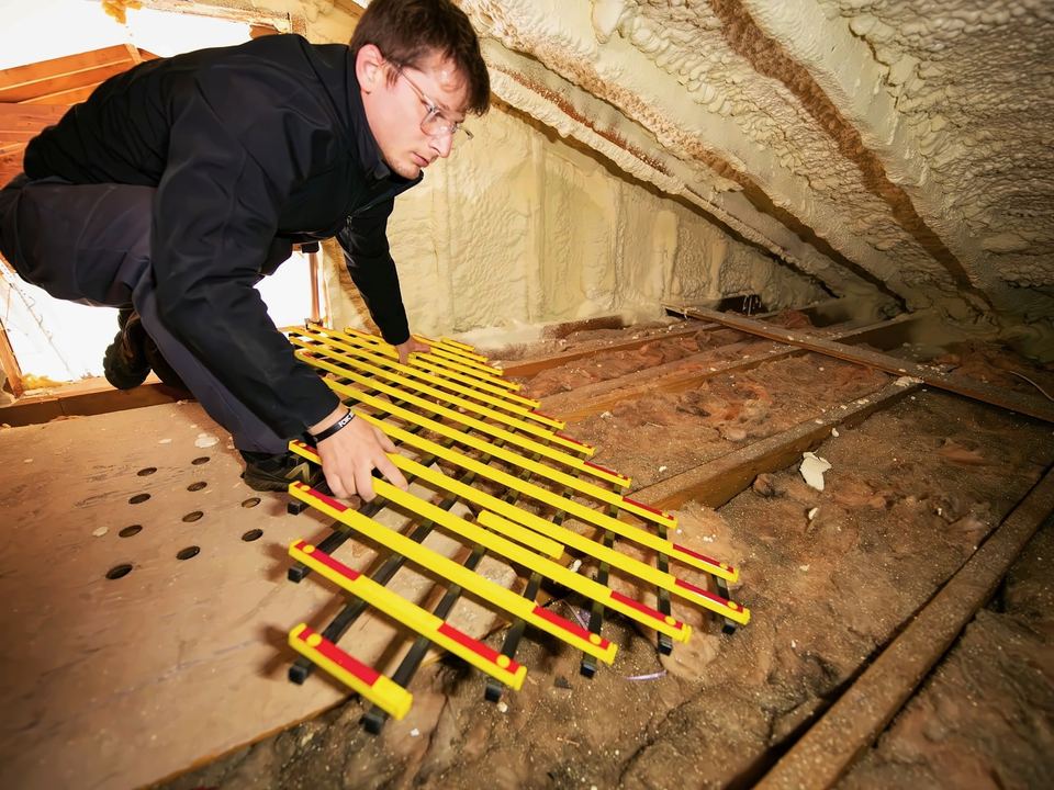 Fitting a floor frame across the joists in a loft