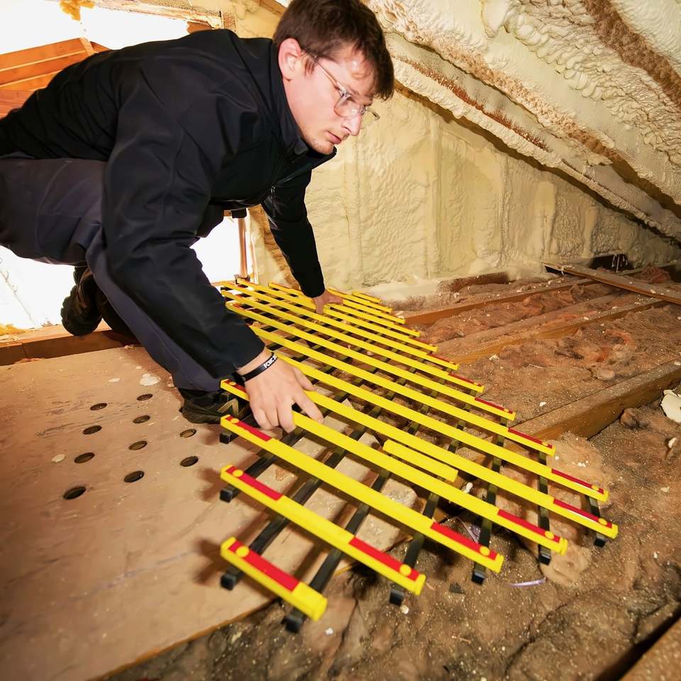 Fitting a floor frame across the joists in a loft